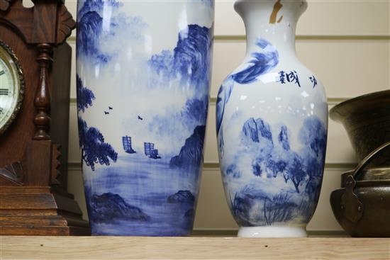 A Chinese blue and white baluster vase, decorated with a landscape, Largest 17.25in.